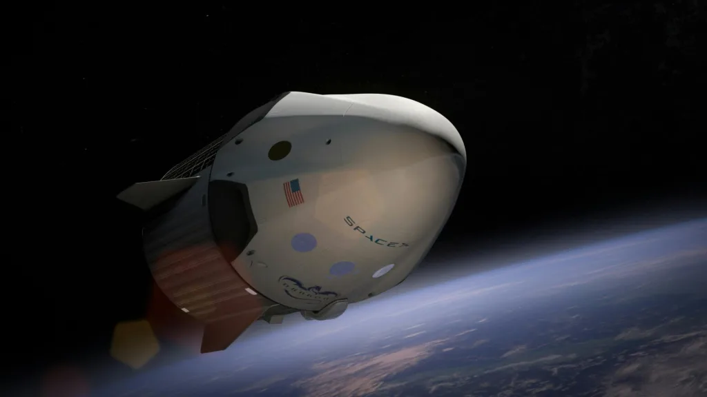 spacex A SpaceX Dragon spacecraft orbiting Earth, captured in vivid detail against space.