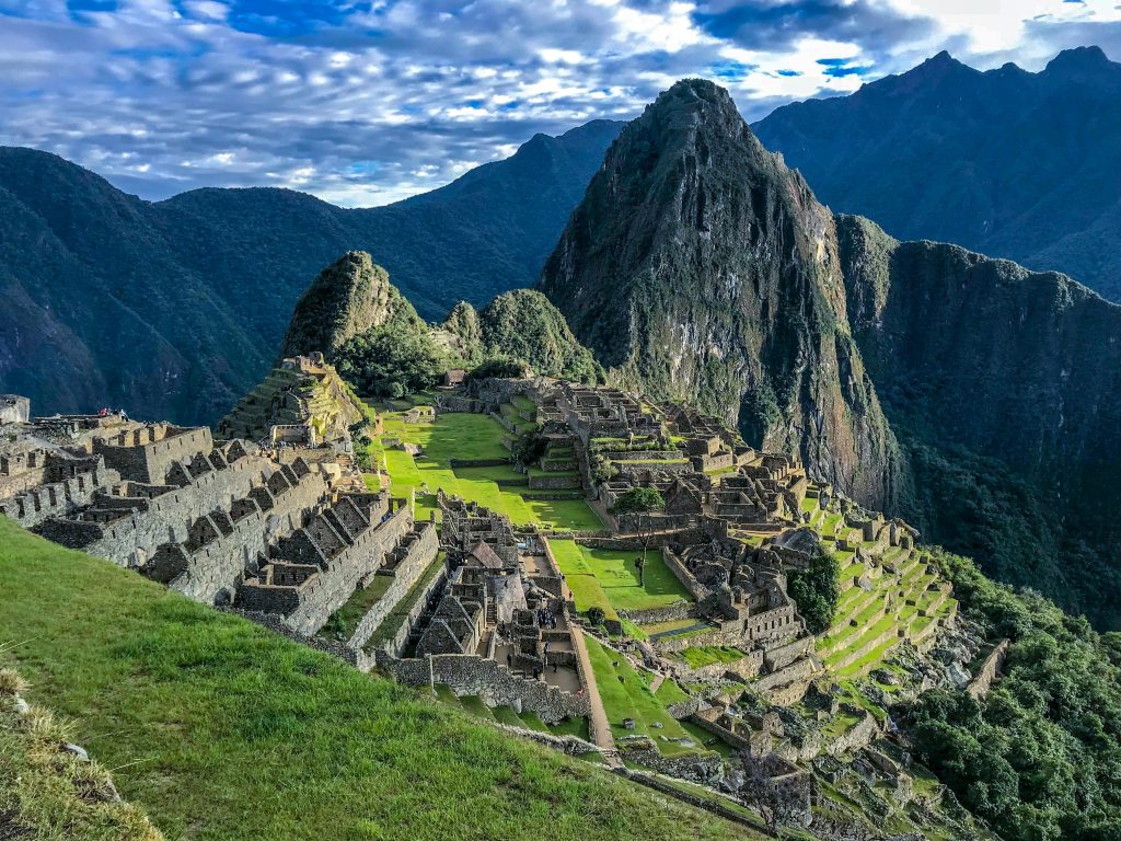 Machu Picchu Explore the stunning ancient ruins of Machu Picchu, a UNESCO World Heritage Site in Peru, surrounded by majestic mountains.