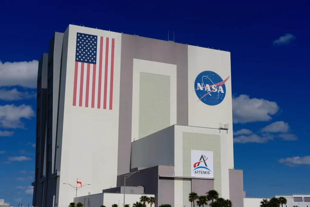 NASA The iconic NASA Vehicle Assembly Building at Kennedy Space Center in bright daylight. it represent space hotels