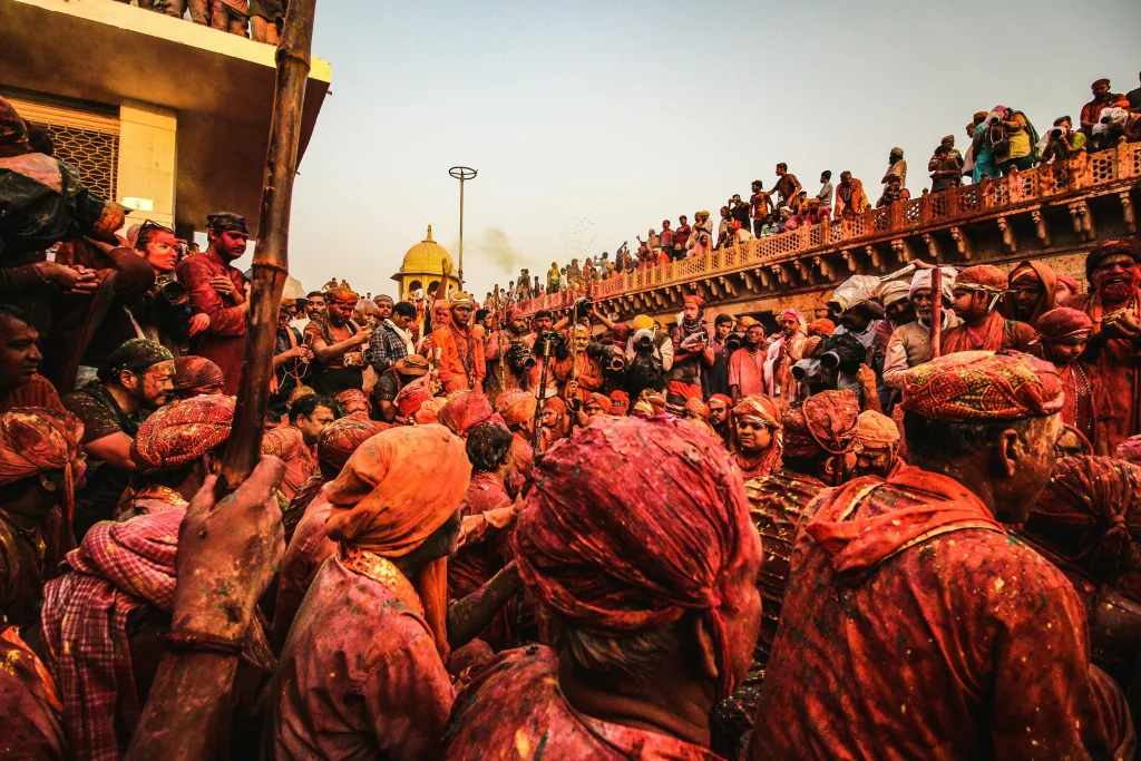 holi A lively crowd celebrating the colorful Holi festival with tradition and joy outdoors in India. it symbolizes interesting Holi facts