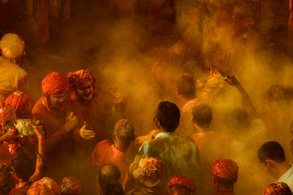 Holi Celebration Colorful and energetic Holi celebration with joyful crowd immersed in vibrant powder.