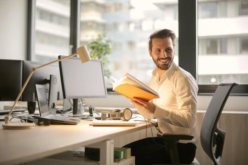 pexels-photo-927022-927022 A relaxed businessman enjoying a break in his bright, contemporary office environment.