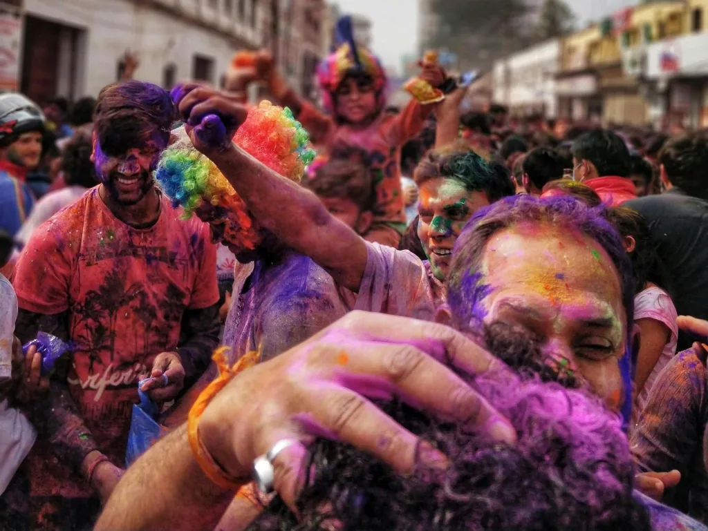 pexels-photo-974320-974320 Colorful celebration of Holi Festival in Gorakhpur, India with joyful crowd covered in powders.