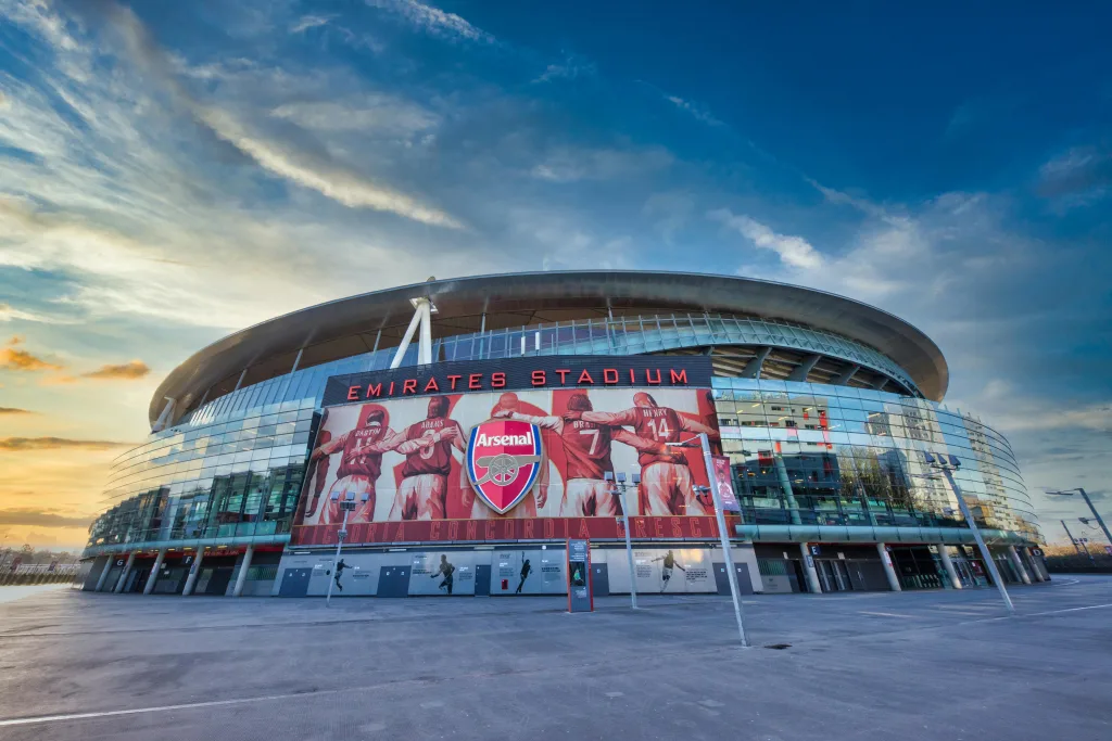 pexels-photo-9251066-9251066 View of Emirates Stadium, home of Arsenal FC in London, showcasing modern architecture under a vibrant sky.